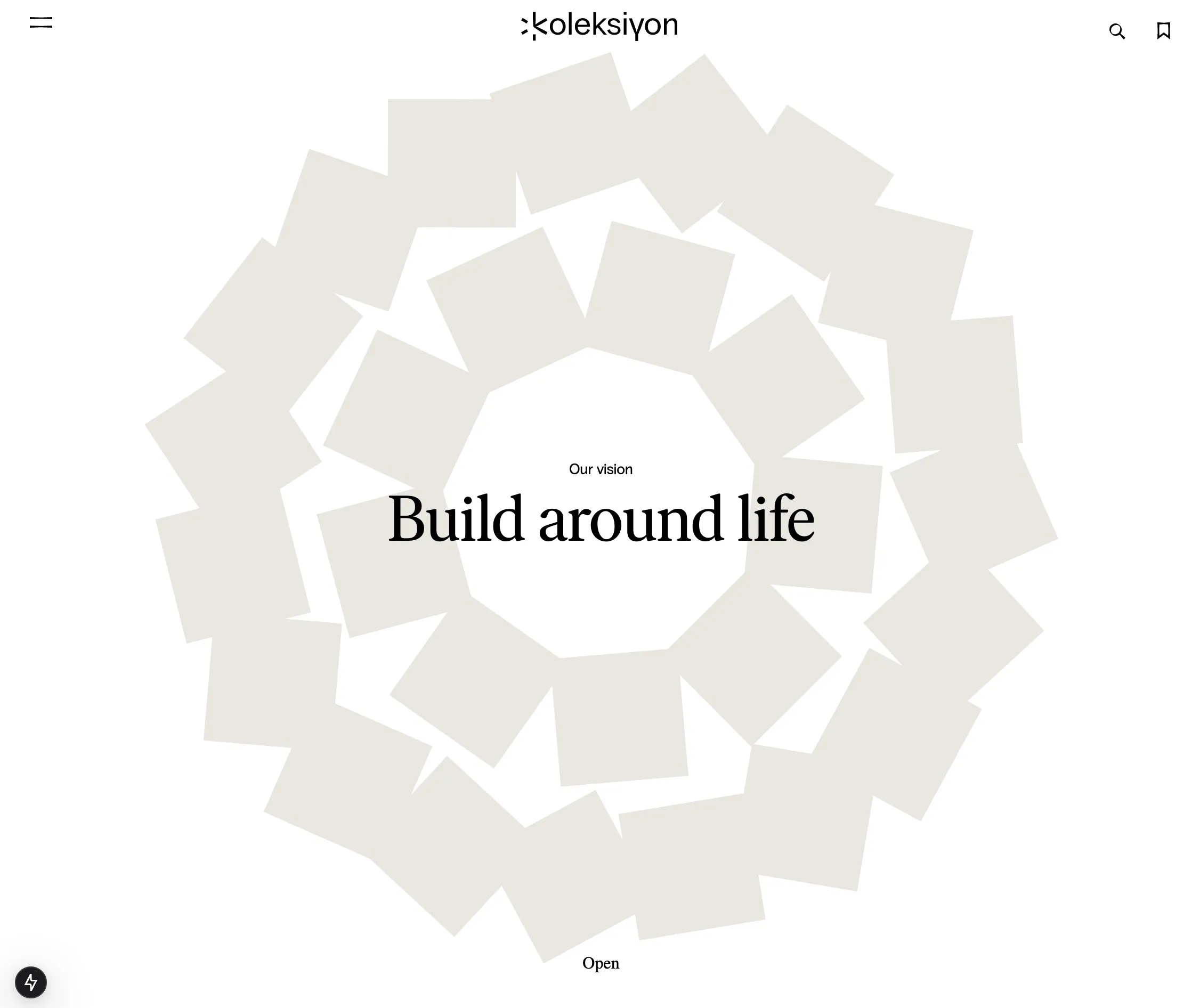 The spiral at rest: concentric rings of blank grey cards, each ring turned at a different angle, around the heading Build around life beneath the Koleksiyon wordmark