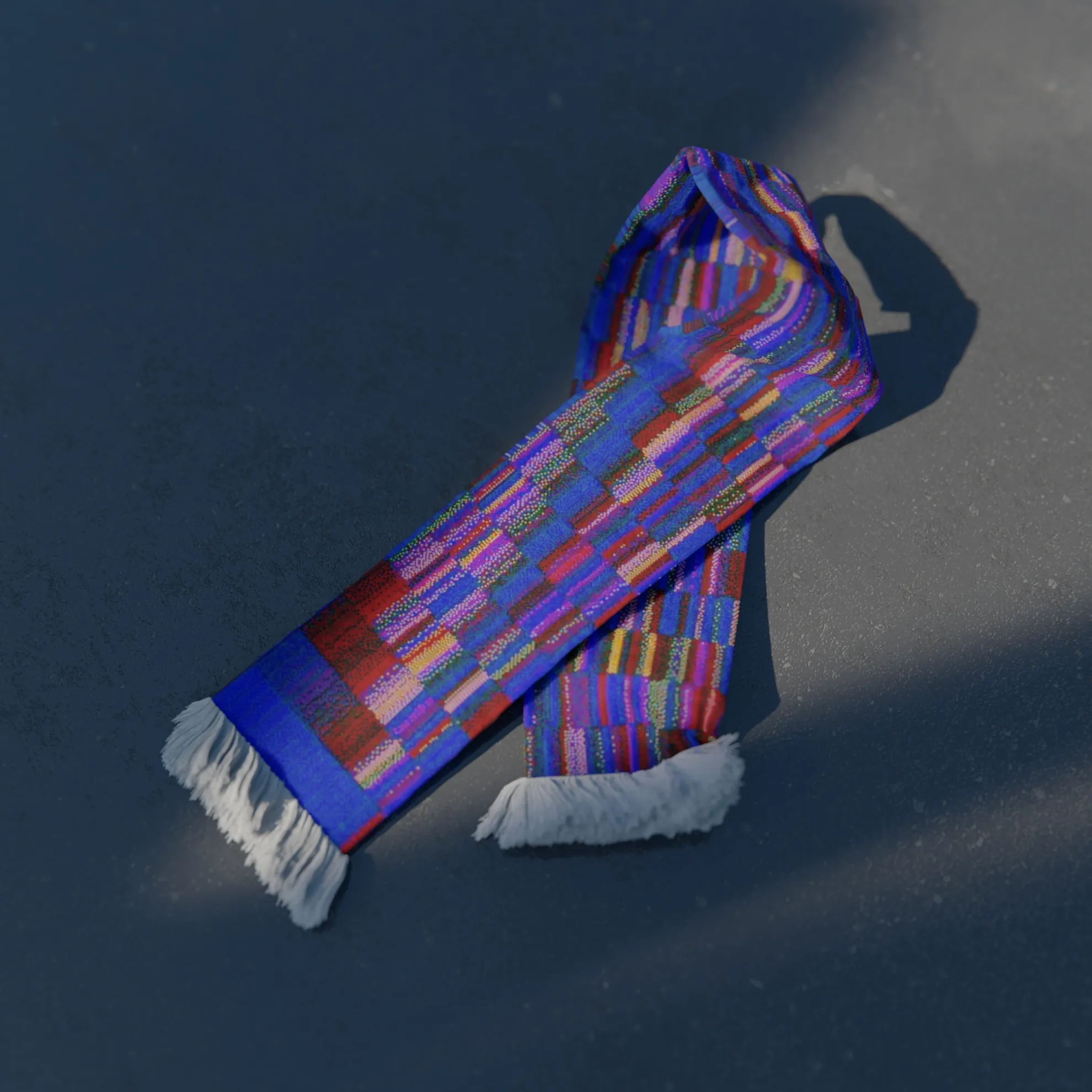 A rendered scarf lying on dark tarmac, printed with a generated grid of blue, red, violet and yellow cells