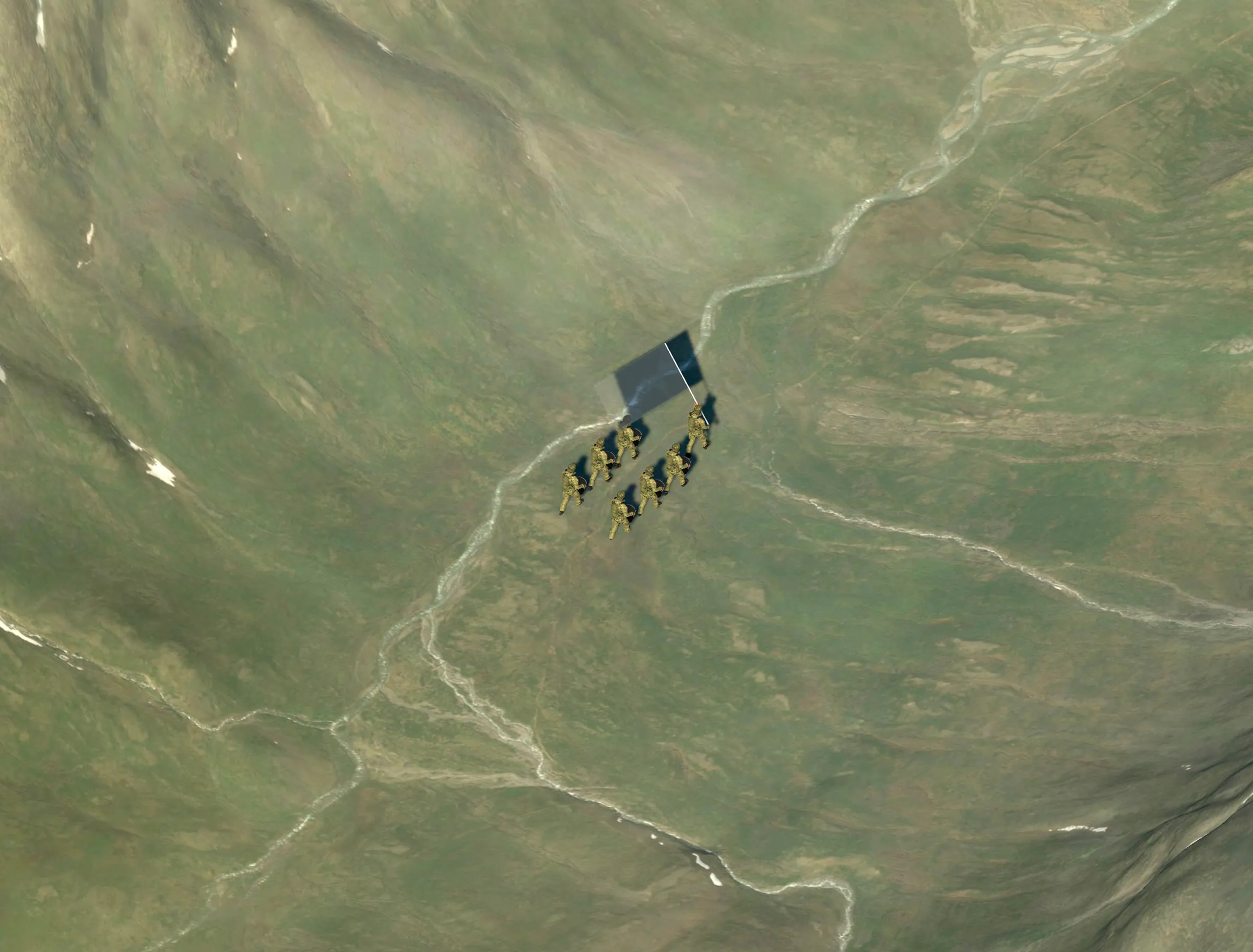The band from high above, a small block of figures and a flag crossing a braided river in a green mountain valley